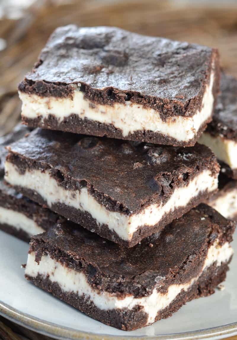 A pile of keto mocha brownies on a white plate. 