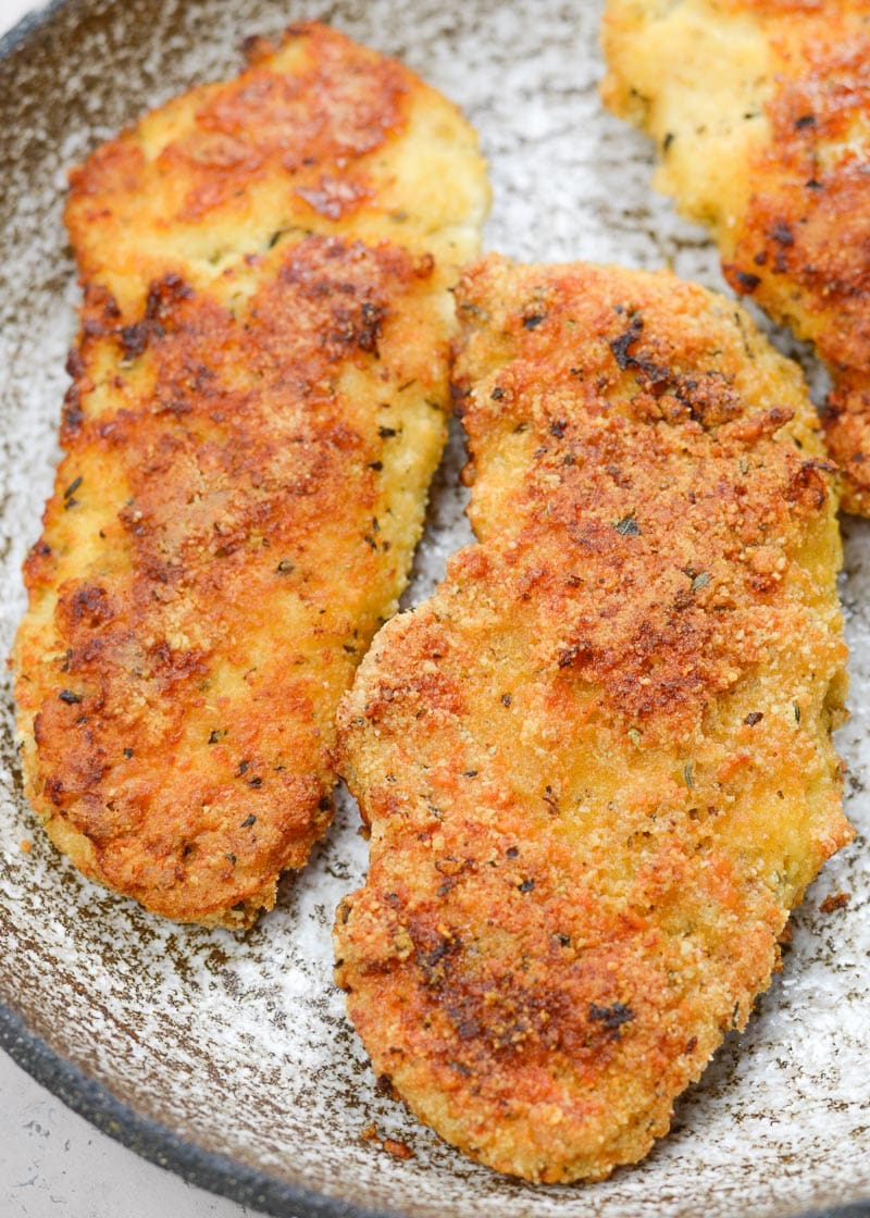 This low carb, gluten free Keto Oven Fried Chicken is exactly what your family ordered! Tender chicken that's "fried" in the oven, this meal is lightened-up comfort food at it's finest!