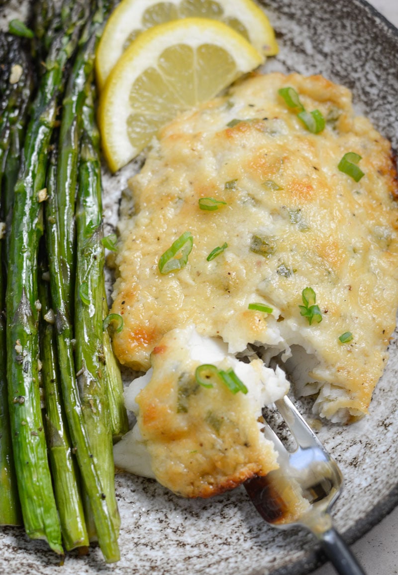 This Keto Parmesan Tilapia and Asparagus is the perfect low carb recipe for one! At only 3.8 net carbs per serving this 20 minute meal is the perfect keto recipe for busy nights!