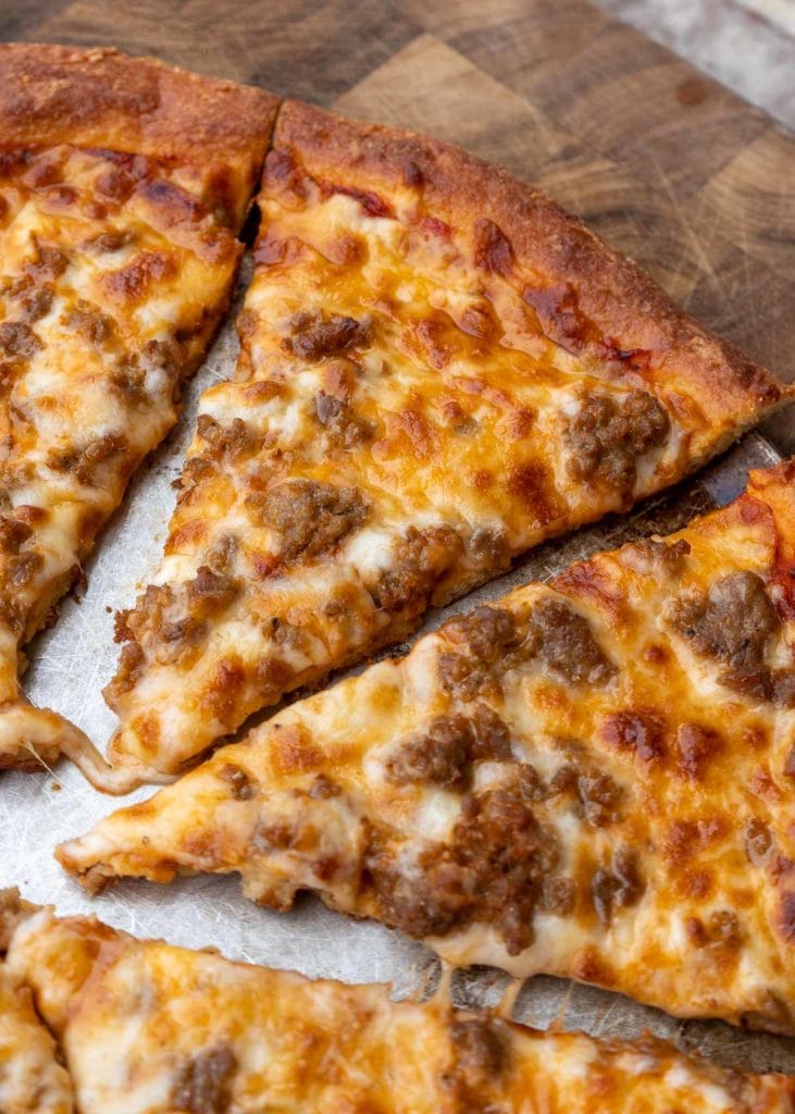 Follow this step by step guide to make the BEST Keto Pizza Crust Recipe! This crust is made from a fat head dough base and is low carb, grain and gluten free!