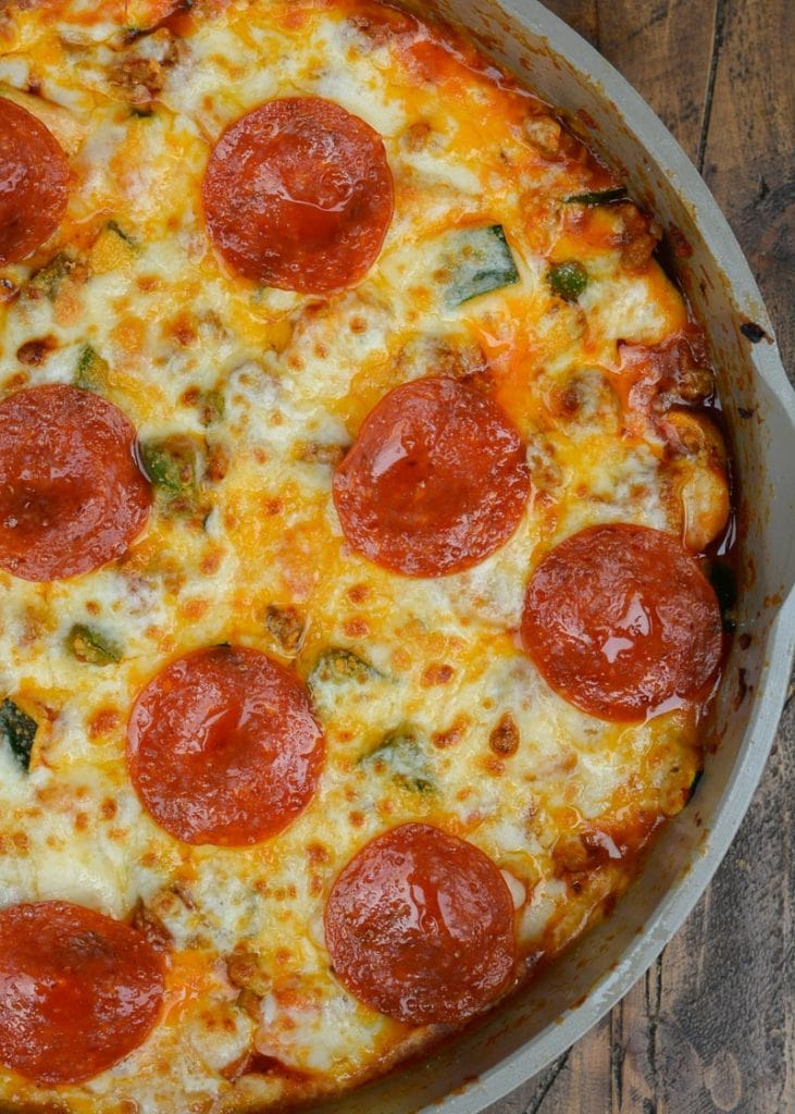 Keto Pizza is the perfect easy dinner recipe! This low carb dinner is packed with Italian sausage, zucchini, peppers, marinara and cheese!