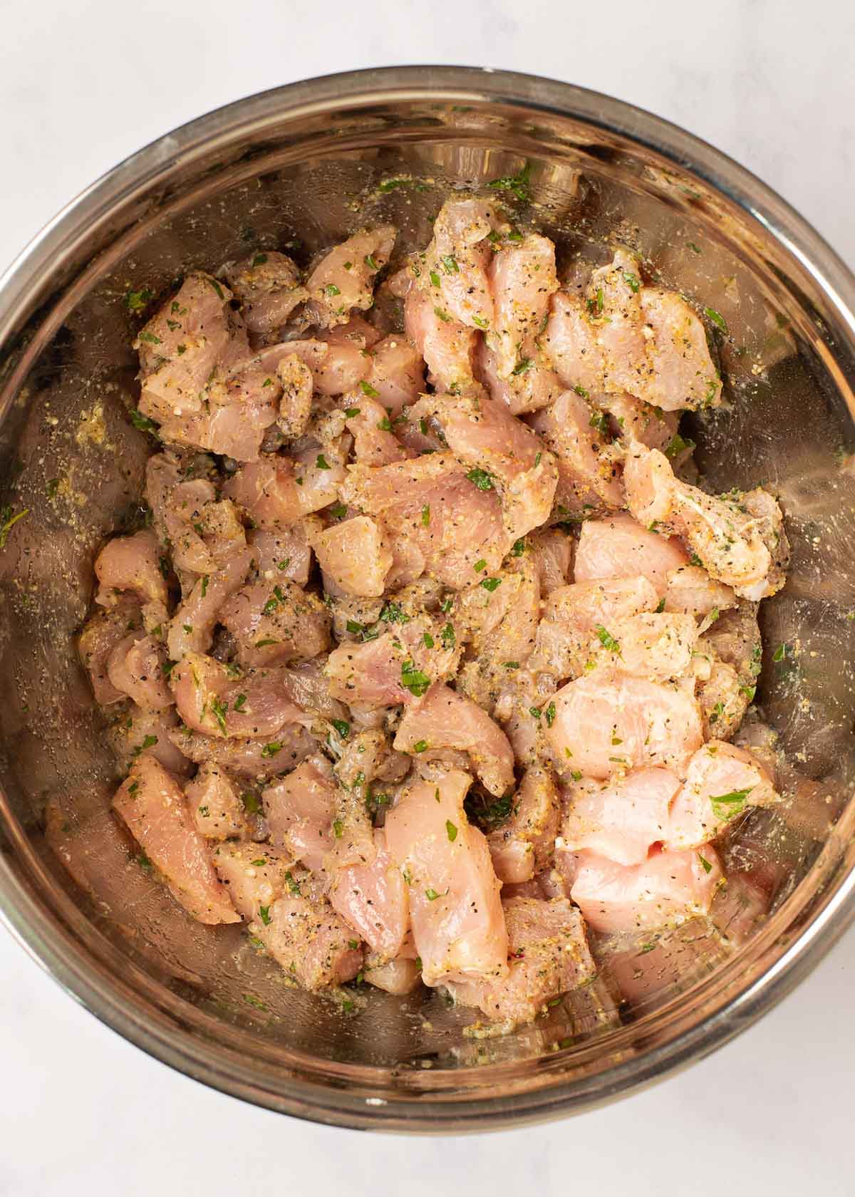 lemon pepper chicken seasoned in a bowl