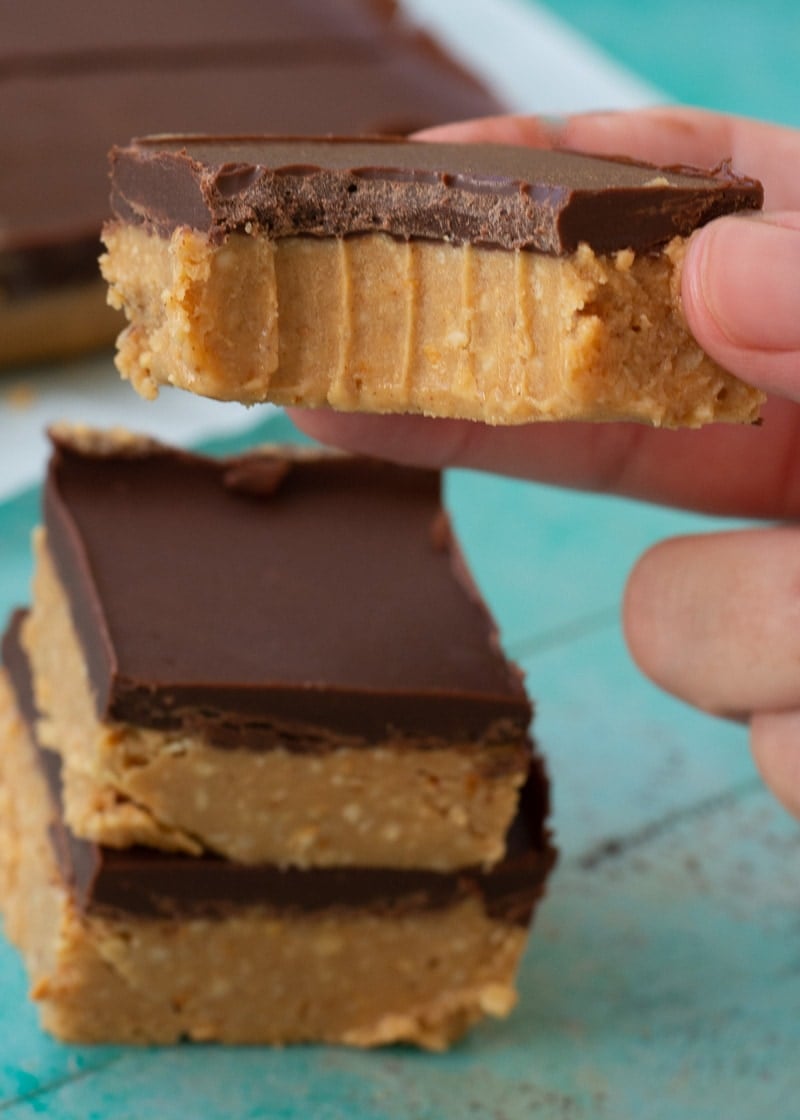 These No Bake Peanut Butter Bars are full of crunchy peanuts and rich dark chocolate! These bars are under 3 net carbs the perfect way to satisfy your sweet tooth!