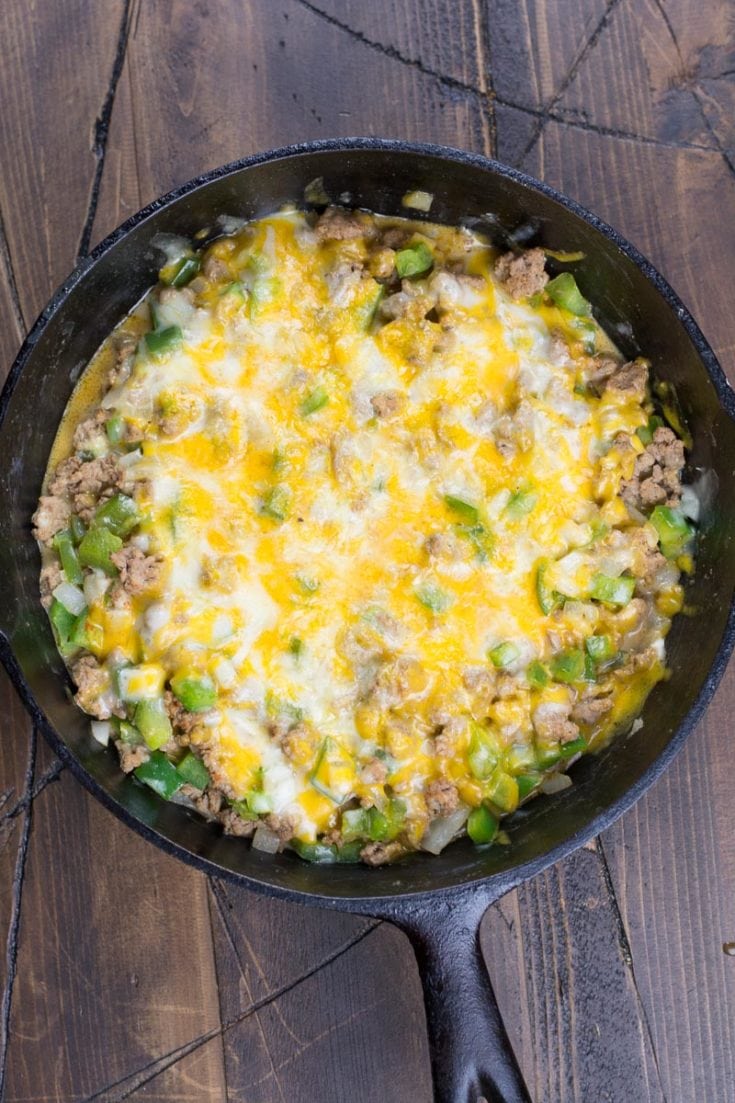 Try this easy One Pan Keto Philly Cheesesteak Skillet for an easy low carb dinner! This 20 minute meal is under 5 net carbs and loaded with ground beef, onions, peppers and cheese!