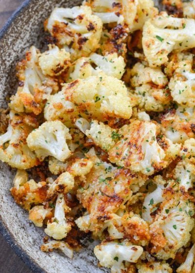 Parmesan Roasted Cauliflower is perfectly seasoned and roasted until crisp and full of flavor! Each serving has about 3 net carbs, making it an excellent keto side dish! 