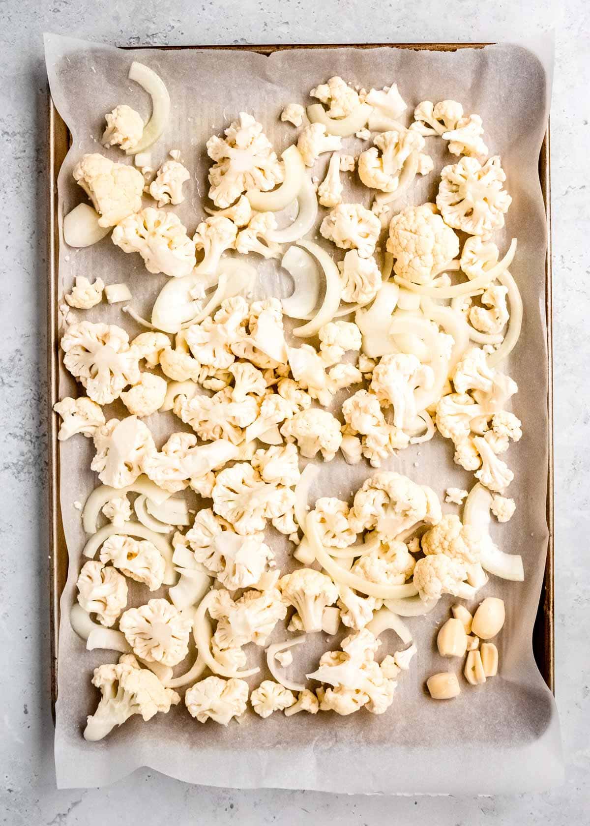 uncooked cauliflower on baking sheet