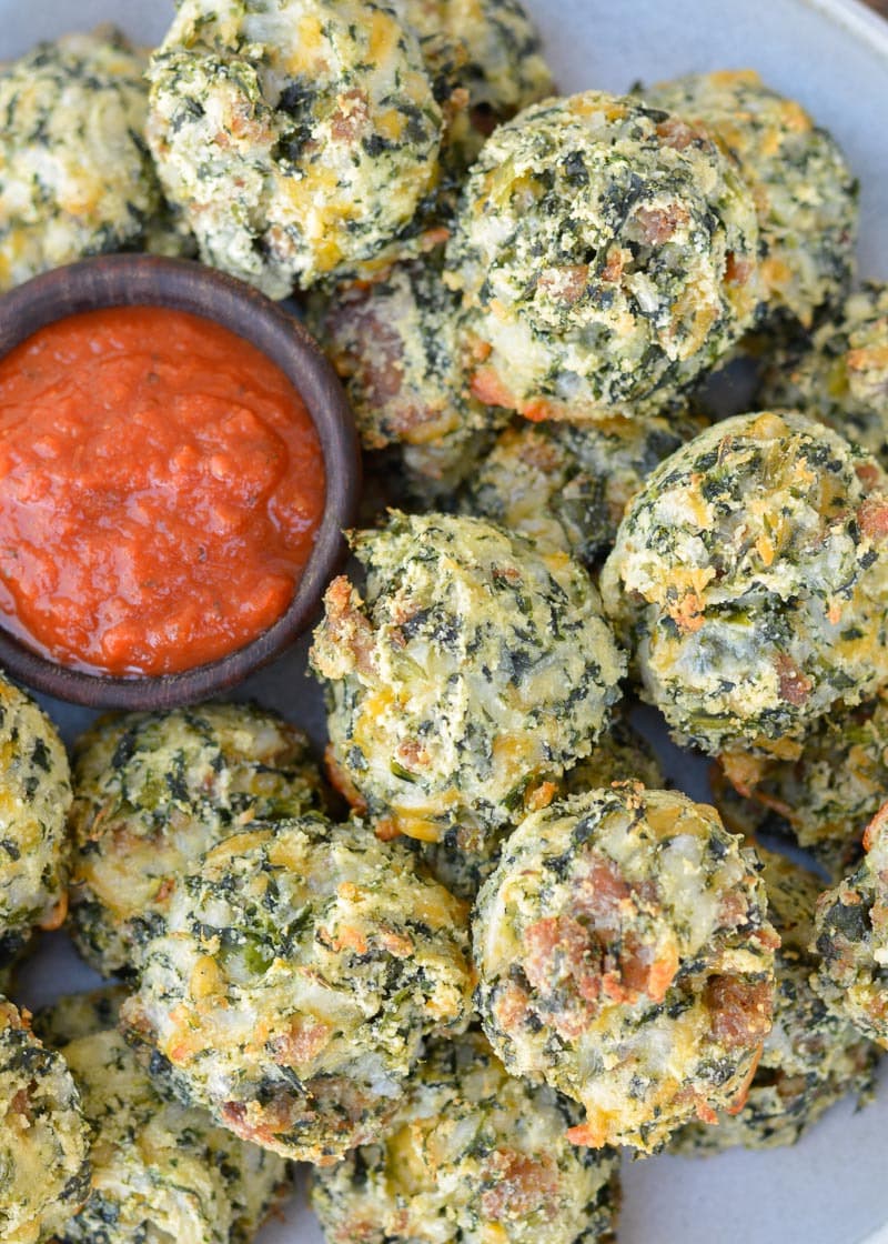 Try these Spinach and Cheese Bites for a savory snack! Loaded with spinach, sausage, and cheese these easy low carb bites make a great keto lunch! Each cheesy bite is under 1 net carb! 