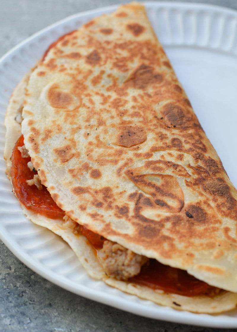 This Supreme Pizza Quesadilla is loaded with all your favorite classic pizza toppings! A low-carb tortilla keeps this recipe perfect for a pizza craving while on keto!