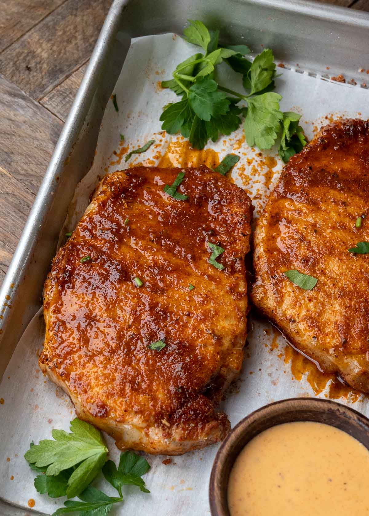 Learn how to make the perfect baked pork chops! This easy pork chop recipe features a homemade rub and is ready in less than 20 minutes!