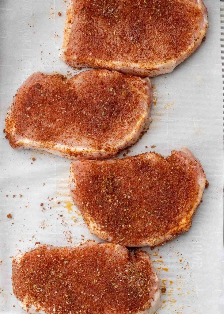 Learn how to make the perfect baked pork chops! This easy pork chop recipe features a homemade rub and is ready in less than 20 minutes!