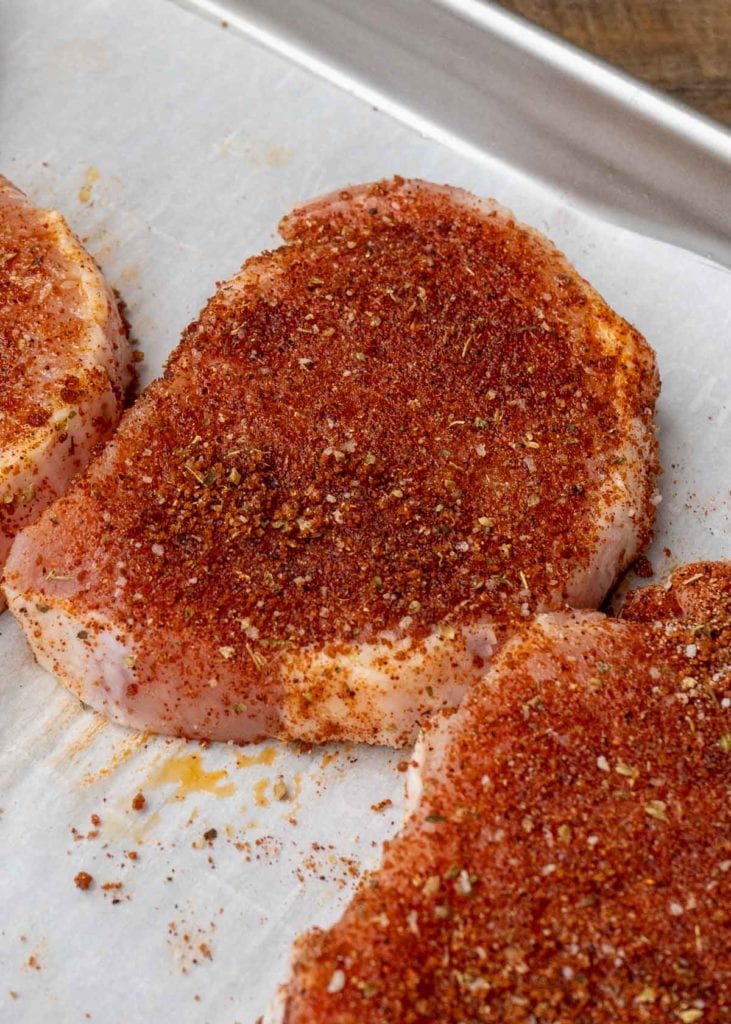 Learn how to make the perfect baked pork chops! This easy pork chop recipe features a homemade rub and is ready in less than 20 minutes!