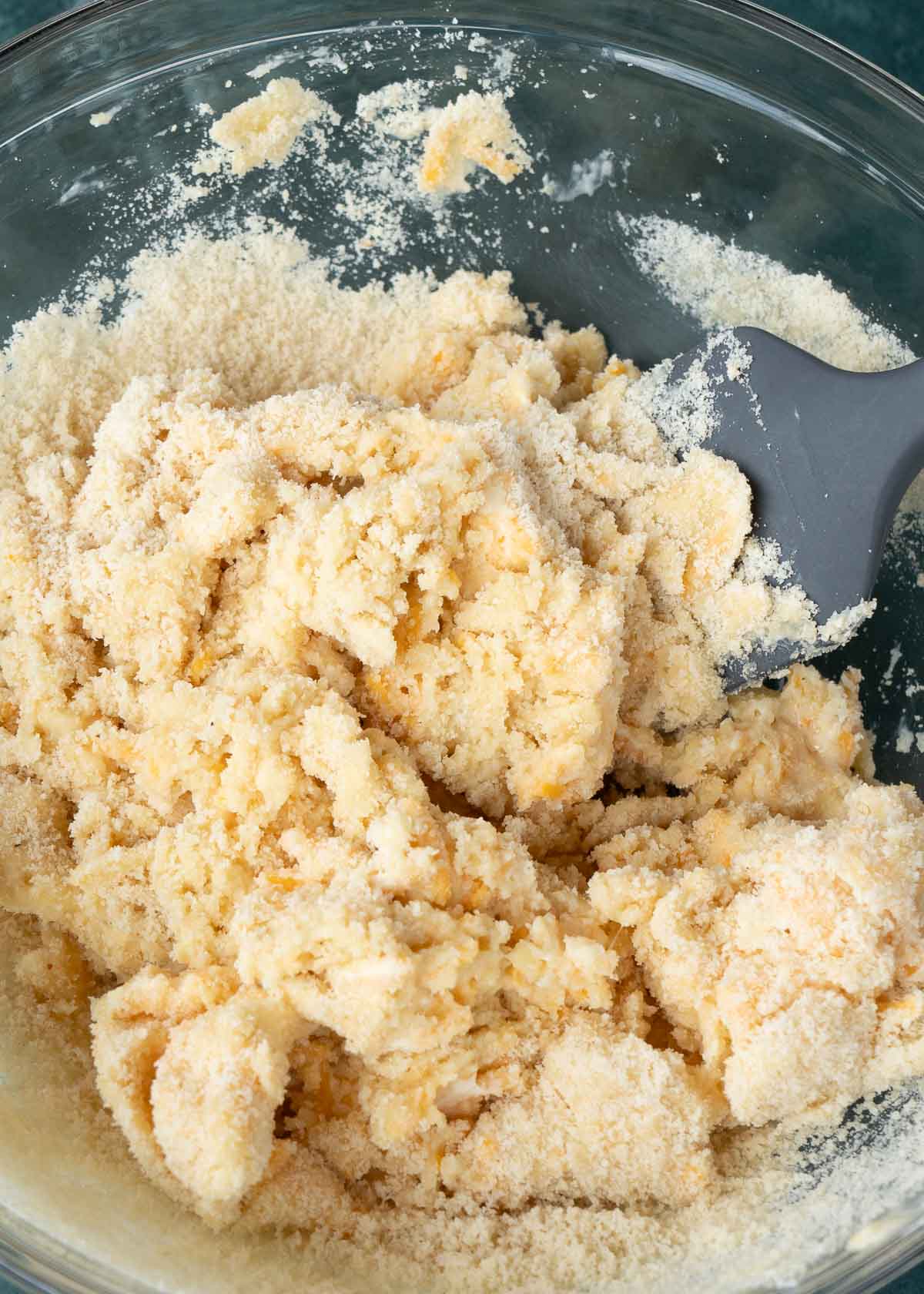 biscuit dough in a clear mixing bowl