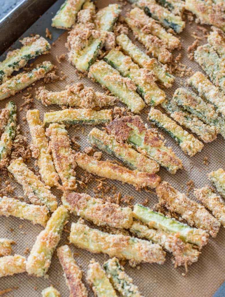 These Crispy Zucchini Fries are breaded with almond flour, parmesan and spices and baked until perfectly crispy! The perfect keto, low carb side dish! #keto